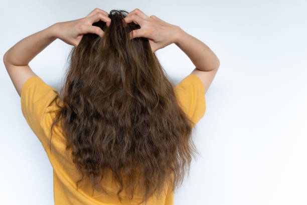 How can I revive my curly hair from heat damage?