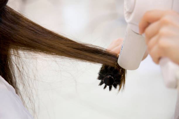 Can I blow dry my hair after bleaching it?
