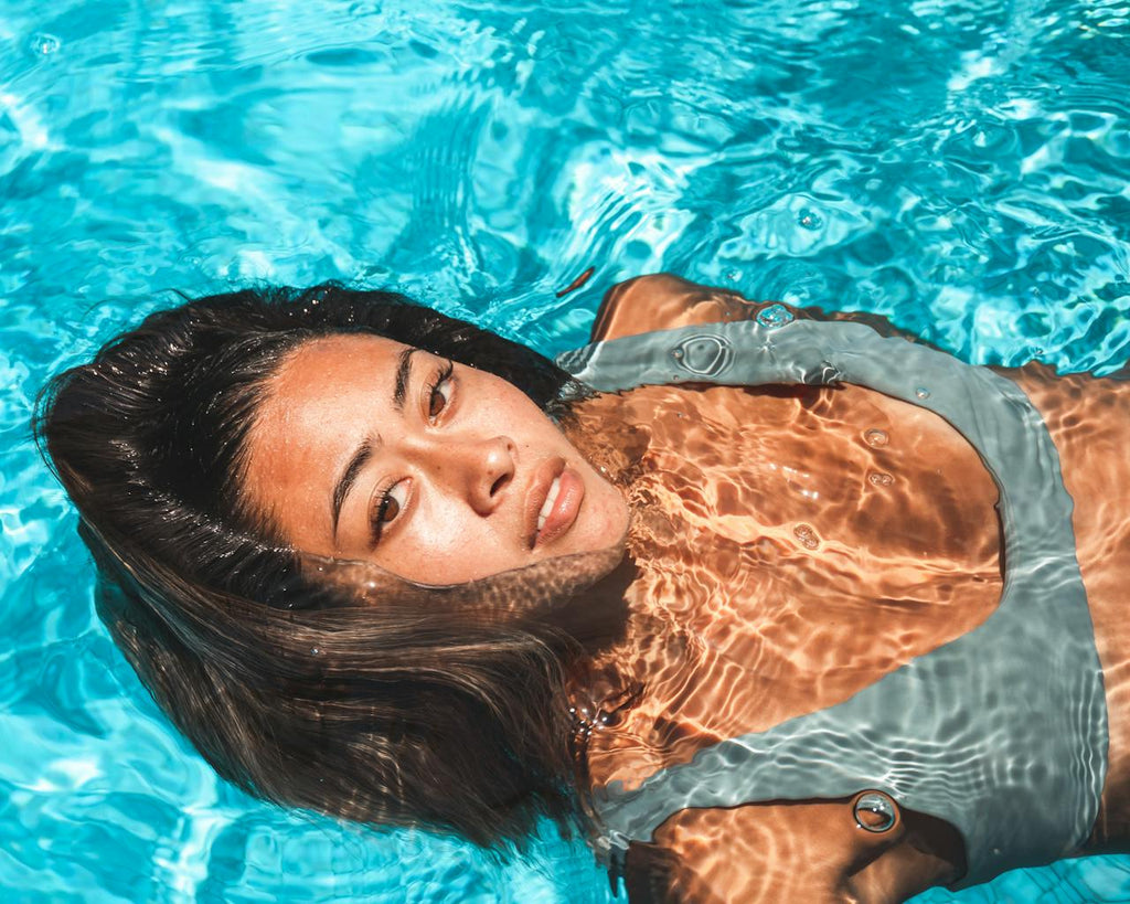 Saltwater vs. Chlorine: How to Tailor Your Haircare to Beach & Pool Swims